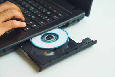 Close-up of person using laptop