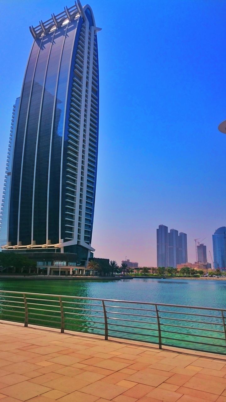 MODERN BUILDINGS AGAINST CLEAR SKY