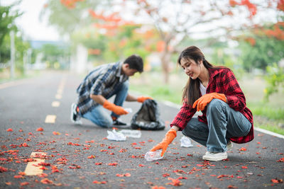 Young couple on road during autumn