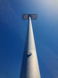 Low angle view of street light against blue sky