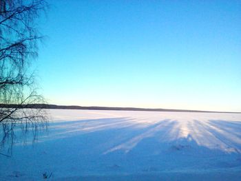 Scenic view of landscape against clear blue sky