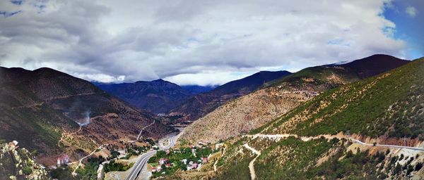 Panoramic view of landscape against cloudy sky