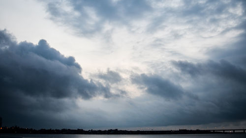 Scenic view of landscape against cloudy sky