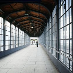 Woman standing on elevated bridge