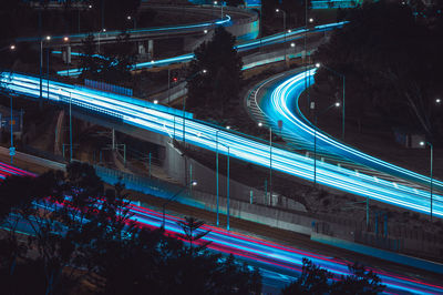 High angle view of light trails on road at night