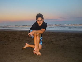 Woman standing on beach