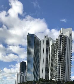 Low angle view of buildings against blue sky