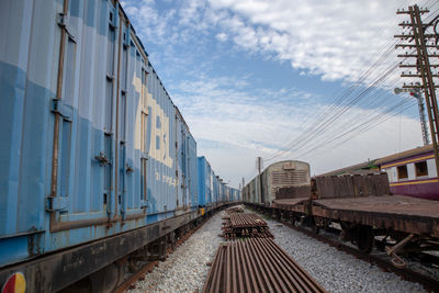 Train on railroad tracks against sky