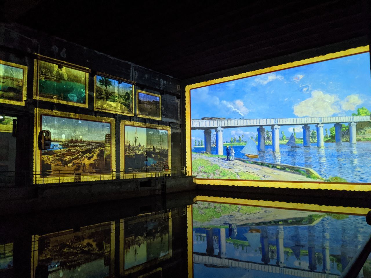 TRAIN AT RAILROAD STATION PLATFORM SEEN THROUGH GLASS WINDOW