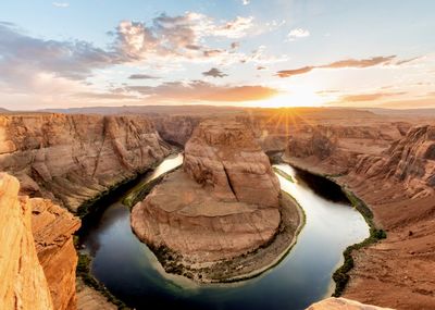 Scenic view of landscape against sky during sunset