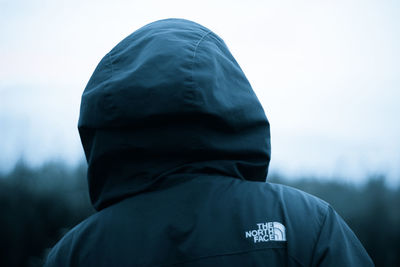 Rear view of man standing against sky