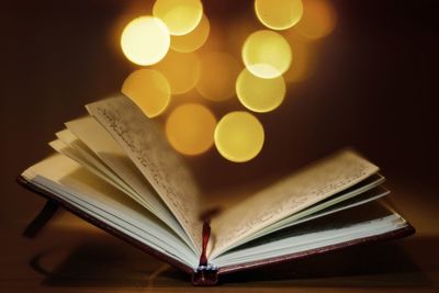 Close-up of illuminated book on table