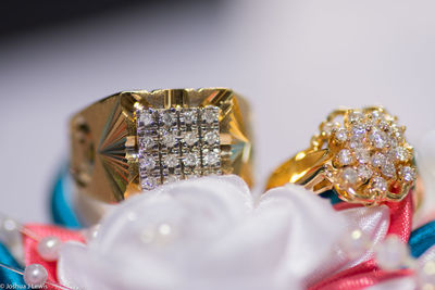 Close-up of wedding rings on table