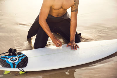 Low section of man on beach