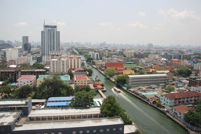 High angle view of buildings in city against sky