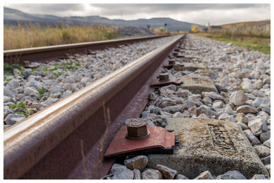 Close-up of railroad track against sky