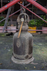 Close-up of sculpture hanging by water