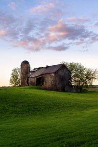 House on field against sky