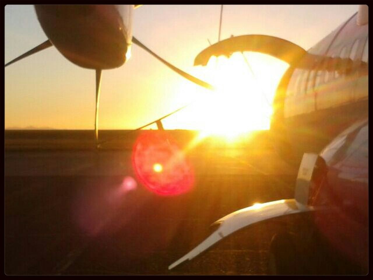 transfer print, sun, sunset, auto post production filter, sunlight, lens flare, orange color, sunbeam, transportation, reflection, indoors, glass - material, close-up, sky, transparent, no people, part of, nature, beauty in nature