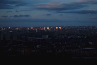 Cityscape against cloudy sky