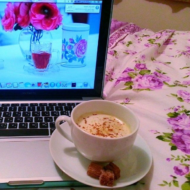 indoors, table, coffee cup, drink, food and drink, refreshment, freshness, coffee - drink, coffee, saucer, cup, still life, plate, tea cup, spoon, home interior, close-up, breakfast, flower, frothy drink