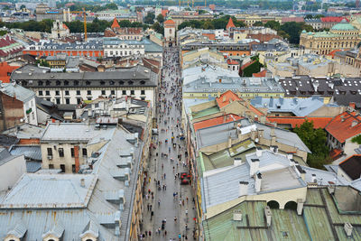 High angle view of people walking on street in city