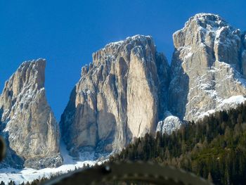 Panoramic view of mountains against clear blue sky