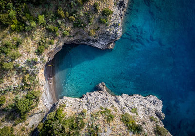 High angle view of rocks in sea