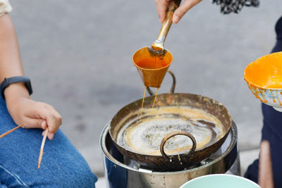 Midsection of man preparing food on table