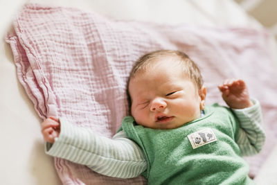 Cute baby lying on bed