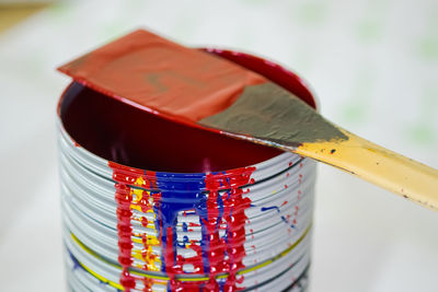 Close-up of paint can with tool
