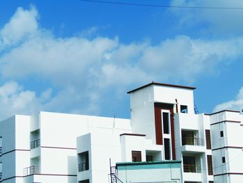 Low angle view of building against blue sky