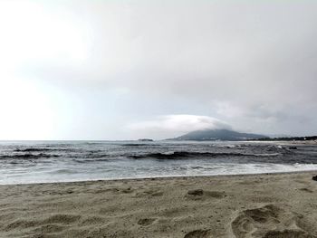 Scenic view of beach against sky