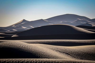 Scenic view of desert against clear sky
