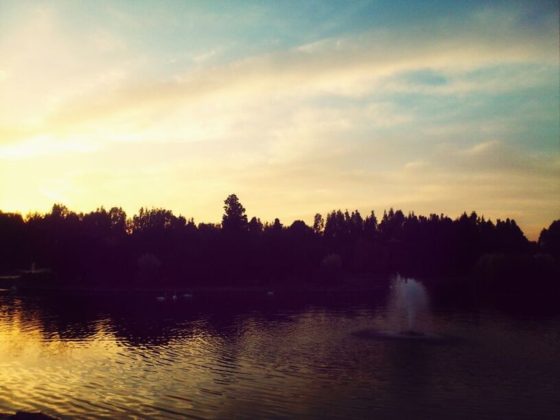 water, sunset, tree, tranquil scene, lake, scenics, waterfront, silhouette, reflection, beauty in nature, tranquility, sky, nature, idyllic, river, cloud - sky, outdoors, orange color, rippled, non-urban scene