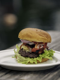 Close-up of burger in plate on table