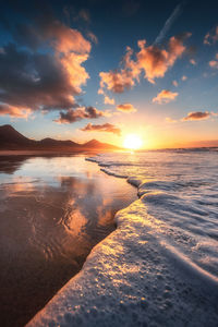 Scenic view of sea against sky during sunset