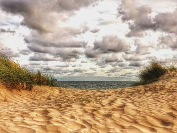 Scenic view of sea against cloudy sky