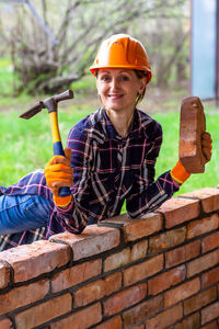 Portrait of smiling man at construction site