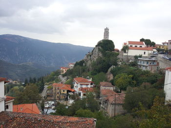 High angle view of town against cloudy sky