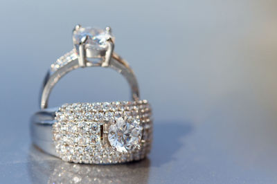 Close-up of wedding rings on table