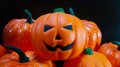 Close-up of pumpkin pumpkins against black background