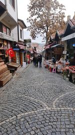 People on street market in city