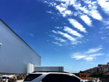 Panoramic view of city against blue sky