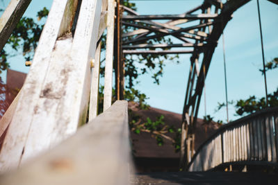 Low angle view of bridge against trees