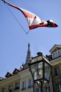 Low angle view of flag against building