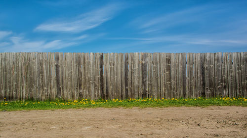 Scenic view of landscape against blue sky