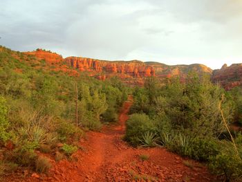 Scenic view of red rock landscape against sky