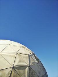 Low angle view of built structure against clear blue sky