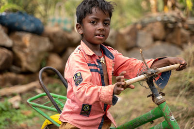 Portrait of boy riding bicycle